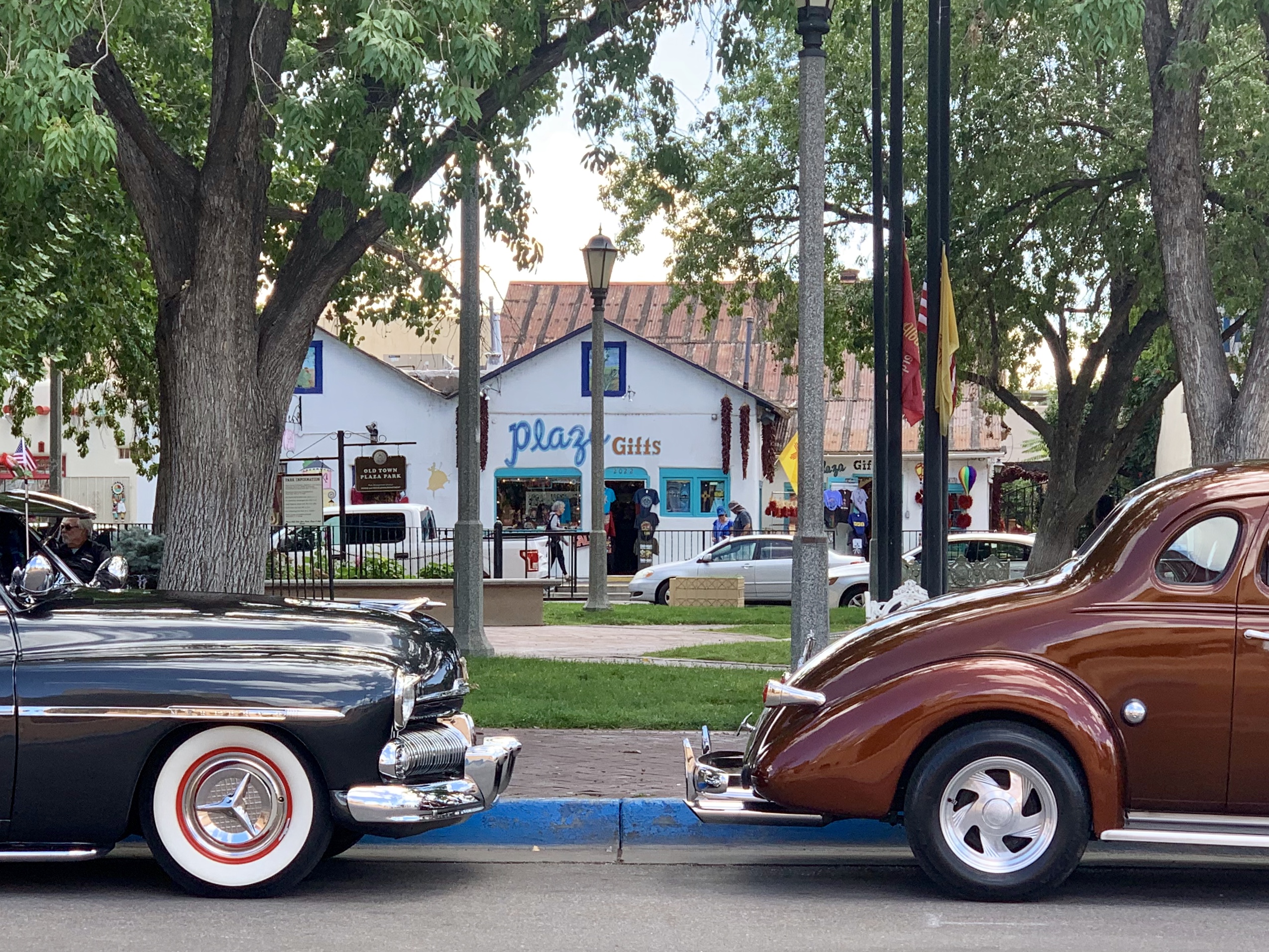 Classic cars parked around the square in Old Town Albuquerque