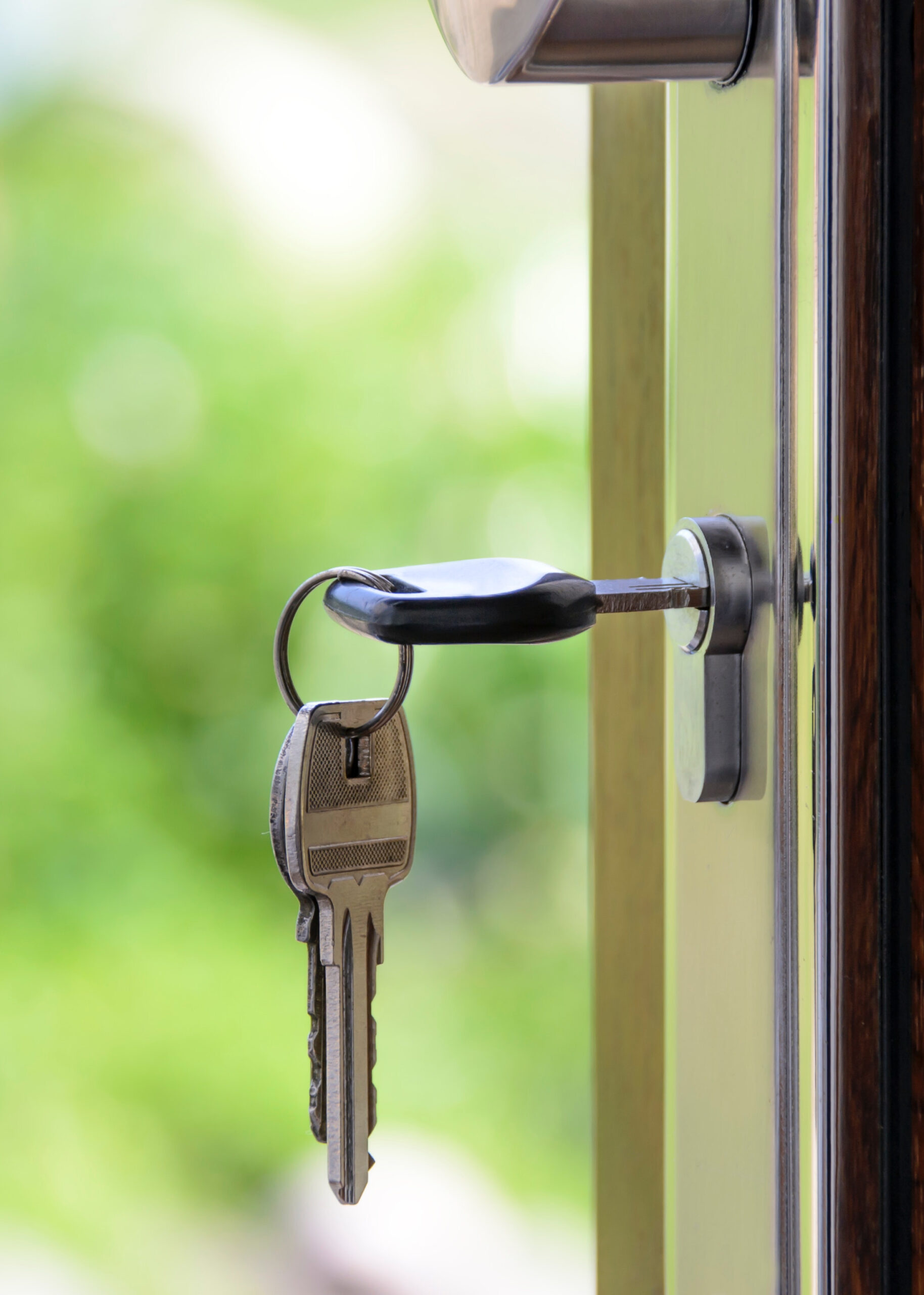 door with key — how to prep your home for a vacation